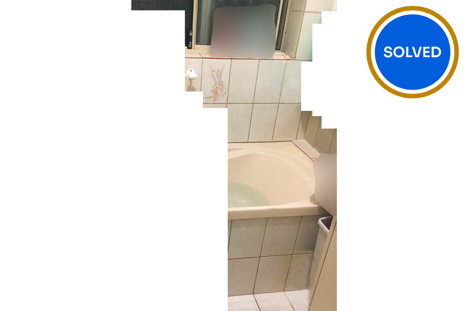 Bathroom with bath tub and tiles with solved banner