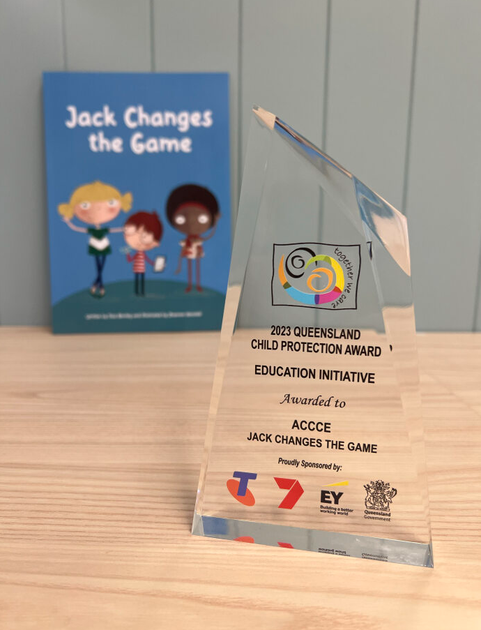 Photo of the award in front of the book Jack Changes the Game 